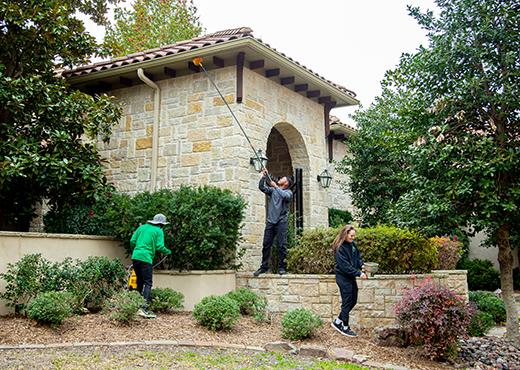 Mosquito Joe team in front of the house.