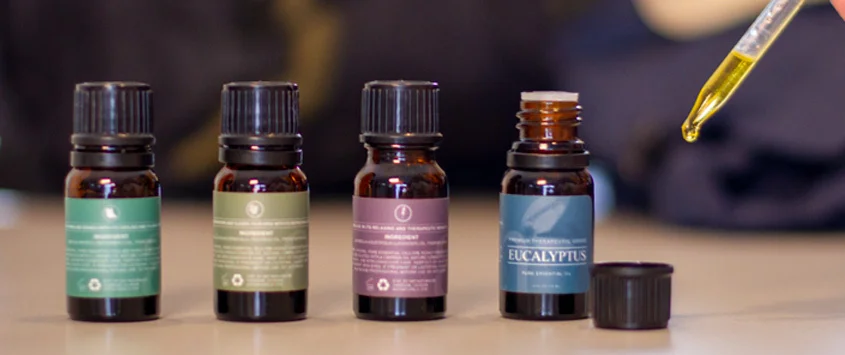 A line up of 4 essential oils.